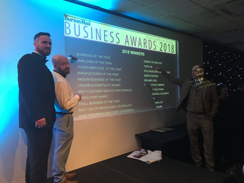 Name in lights. Jason and Mike pointing out Tuffa's Employer of the Year award